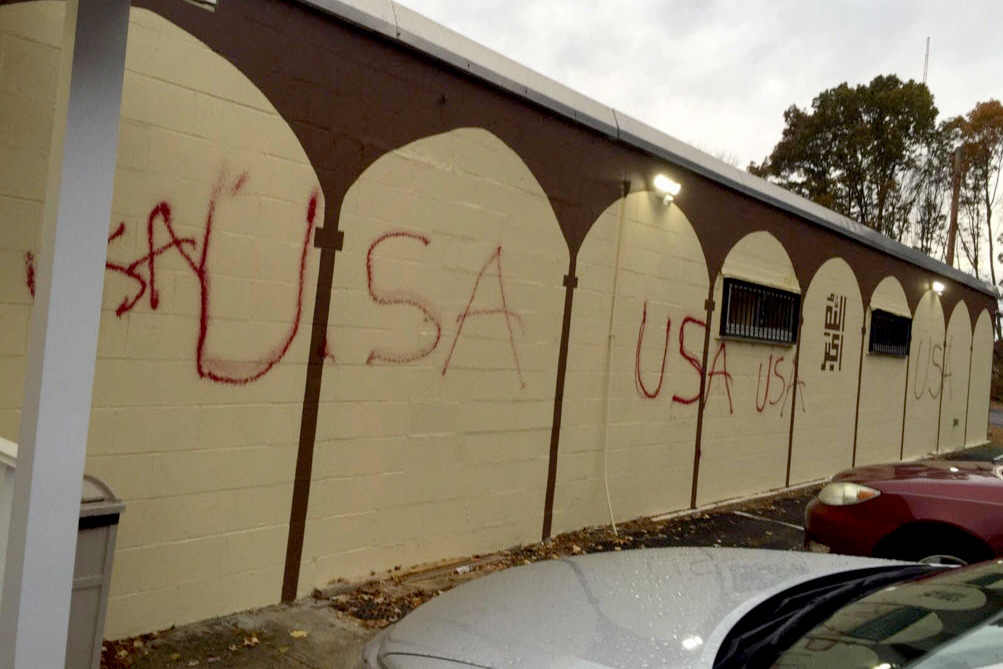 <p>Graffiti vandalism spray-painted on the side of the Islamic Center of Burlington in Burlington, Mass.</p>