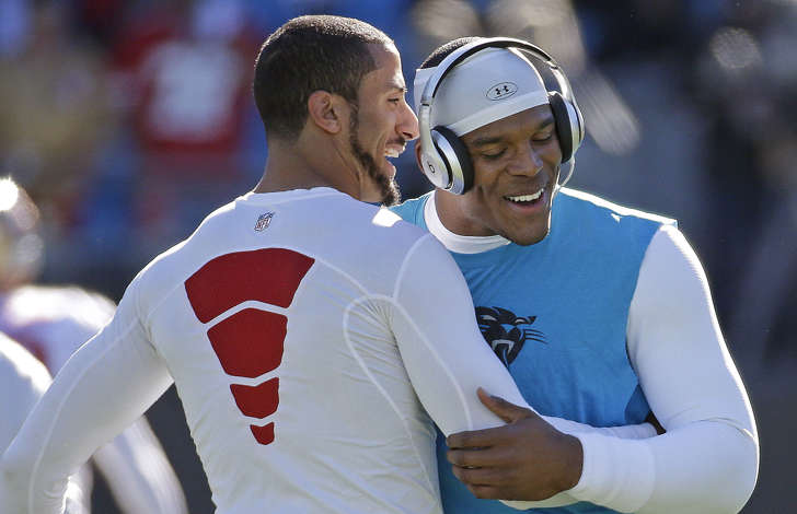 San Francisco 49ers quarterback Colin Kaepernick, left and Carolina Panthers quarterback Cam Newton embrace before the first half of a divisional playoff NFL football game, Sunday, Jan. 12, 2014, in Charlotte, N.C.