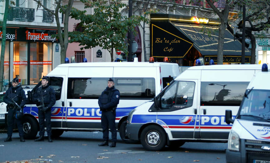 Police vehicles block the street in front of the Bataclan concert hall the morning after a series of deadly attacks in Paris , November 14, 2015. Charles Platiau/Reuters