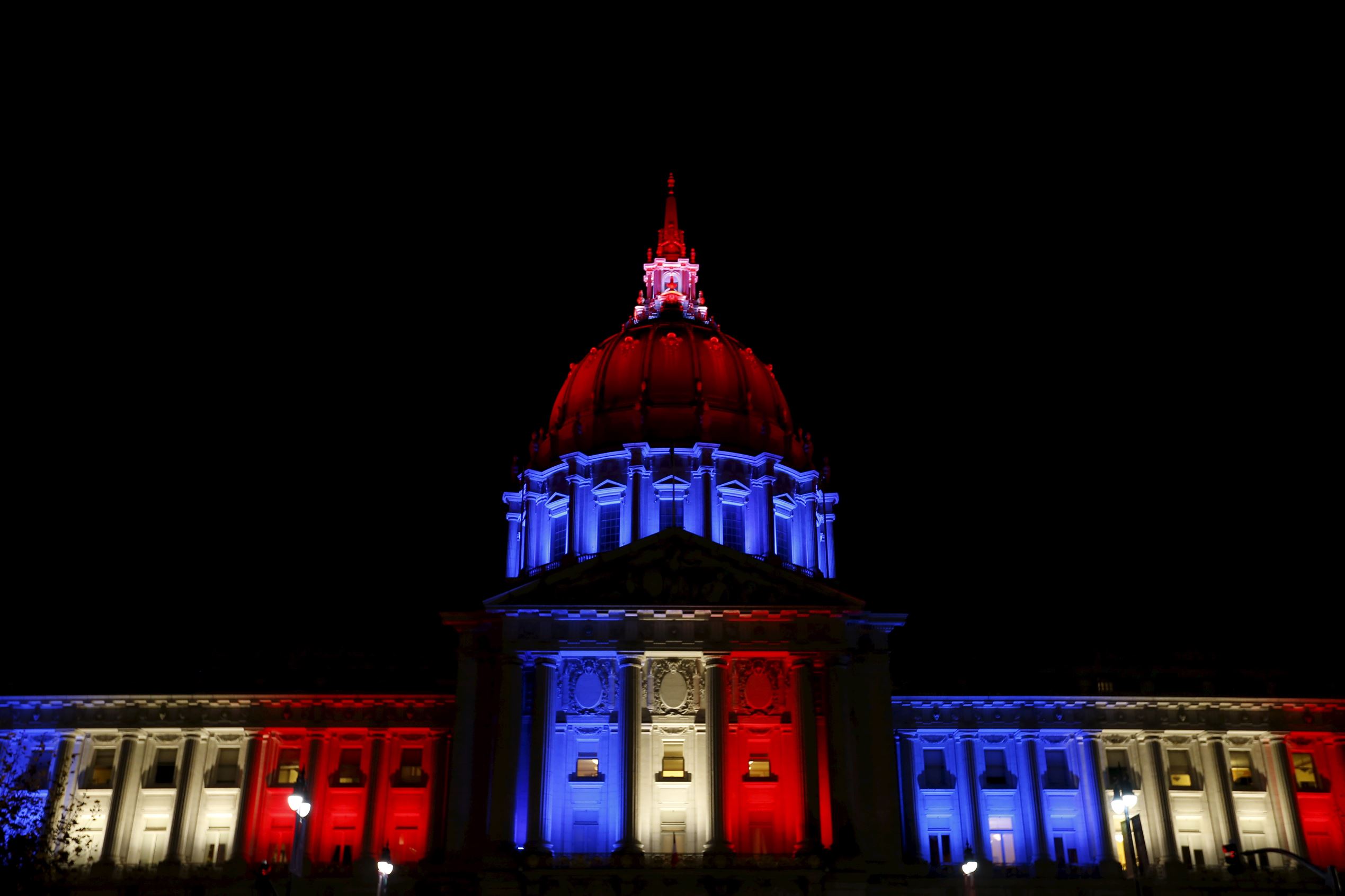 San Francisco City Hall is lit up with blue, white and red, the colors of the French flag, following the Paris terror attacks, in San Francisco, California, November 13, 2015.