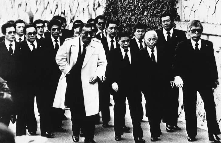 Top members of the Yamaguchi-gumi, Japan's largest Yakuza organization, arrive for the funeral for their boss Masahisa Takenaka in Kobe, western Japan, Dec. 15, 1988.