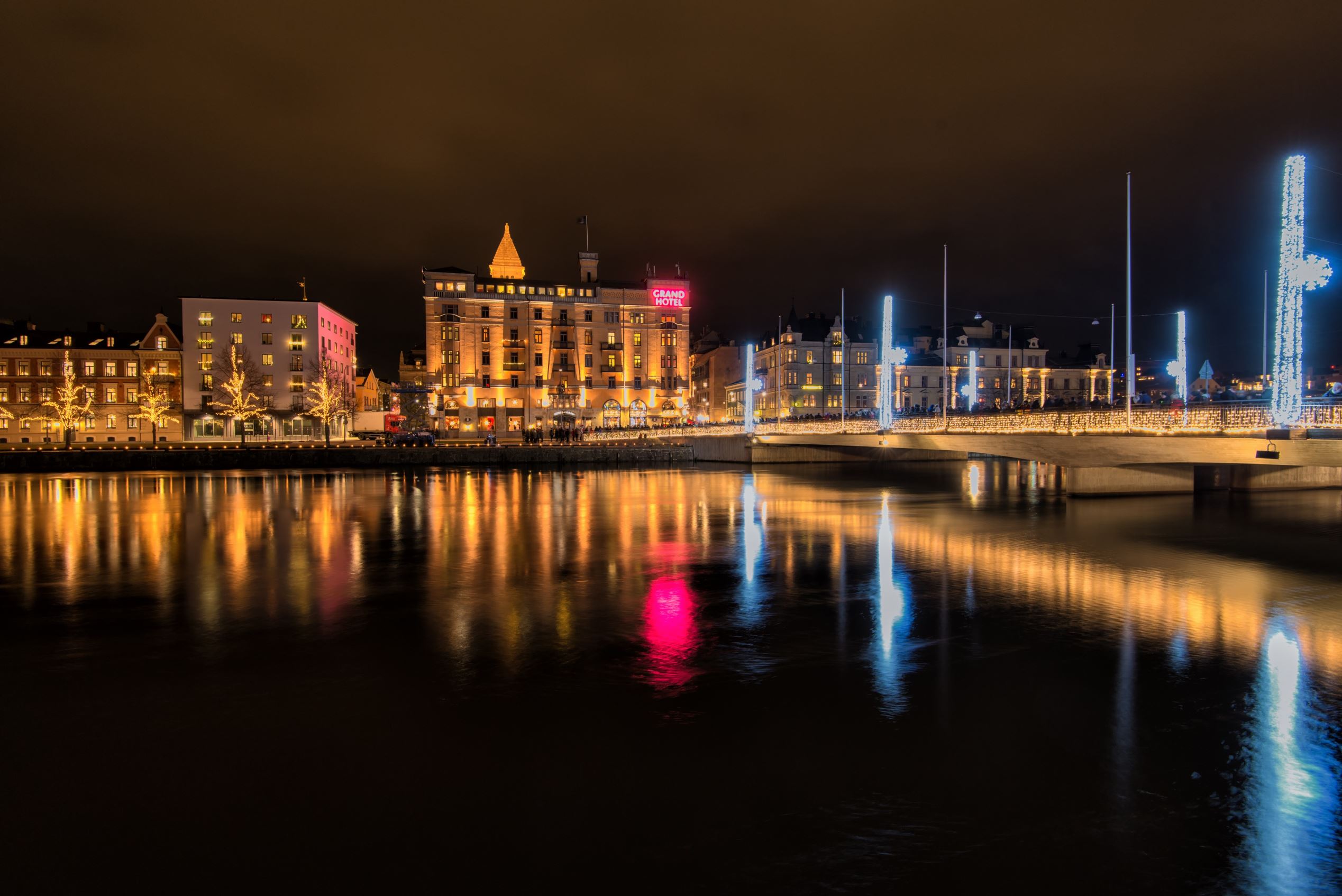 Norrkoping, Sweden – December 31, 2013: Christmas decorated bridge across Motala stream in Norrkoping on New Year's Eve. Norrkoping is a historic industrial town, which is illuminated during Christmas time and New Year's Eve.