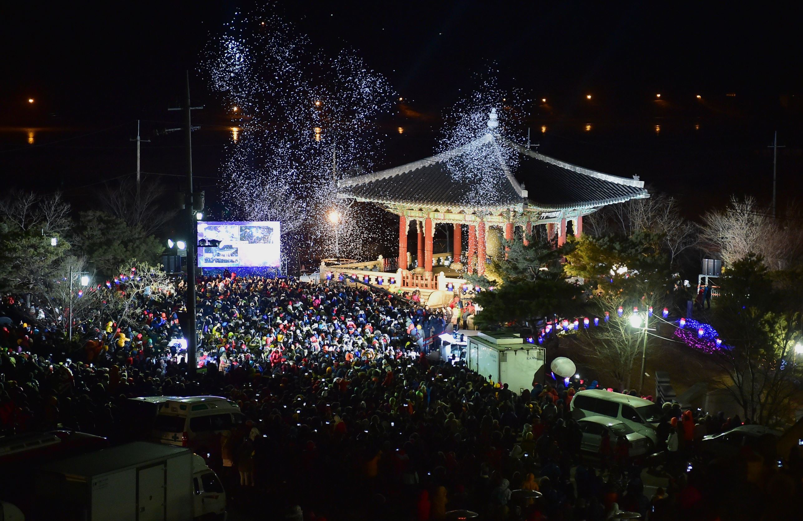 South Koreans gather during the welcoming ceremony of the New Year at Imjingak peace park in the border city of Paju near the Demilitarized zone dividing the two Koreas on January 1, 2015. In a New Year's message, South Korean President Park Geun-Hye called on the military to maintain its readiness, saying robust security is a must to lay the groundwork for potential unification with North Korea. AFP PHOTO / JUNG YEON-JE (Photo credit should read JUNG YEON-JE/AFP/Getty Images)