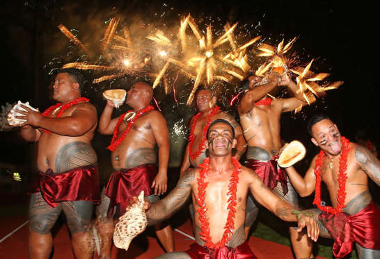APIA, SAMOA - SEPTEMBER 11: Samoan dancers perform as fireworks explode during the Closing Ceremony at the Apia Park Sports Complex on day five of the Samoa 2015 Commonwealth Youth Games on September 11, 2015 in Apia, Samoa. (Photo by Scott Barbour/Getty Images)