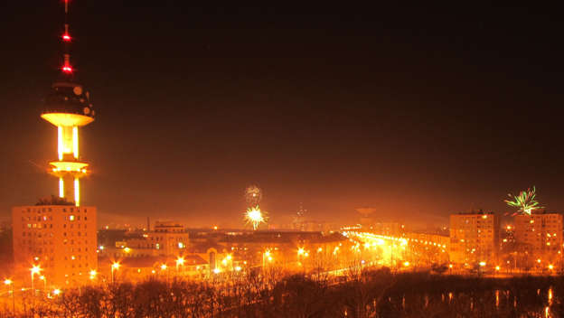 Fireworks and night cityscape of a suburb of Szeged, Hungary, New years eve