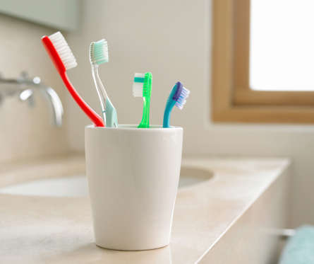 Toothbrushes in a cup,