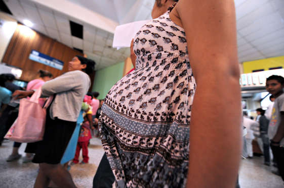 Pregnant women wait to be attended at the Maternal and Children's Hospital in Tegucigalpa on January 21, 2016. The medical school at the National Autonomous University of Honduras (UNAH) recommended that women in the country avoid getting pregnant for the time being due to the presence of the Zika virus. If a pregnant woman is infected by the virus, the baby could be born with microcephaly. AFP PHOTO/Orlando SIERRA / AFP / ORLANDO SIERRA        (Photo credit should read ORLANDO SIERRA/AFP/Getty Images)