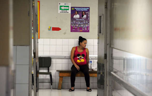 A pregnant woman waits to be attended at the Maternal and Children's Hospital in Tegucigalpa on January 21, 2016. The medical school at the National Autonomous University of Honduras (UNAH) recommended that women in the country avoid getting pregnant for the time being due to the presence of the Zika virus. If a pregnant woman is infected by the virus, the baby could be born with microcephaly. AFP PHOTO/Orlando SIERRA / AFP / ORLANDO SIERRA        (Photo credit should read ORLANDO SIERRA/AFP/Getty Images)