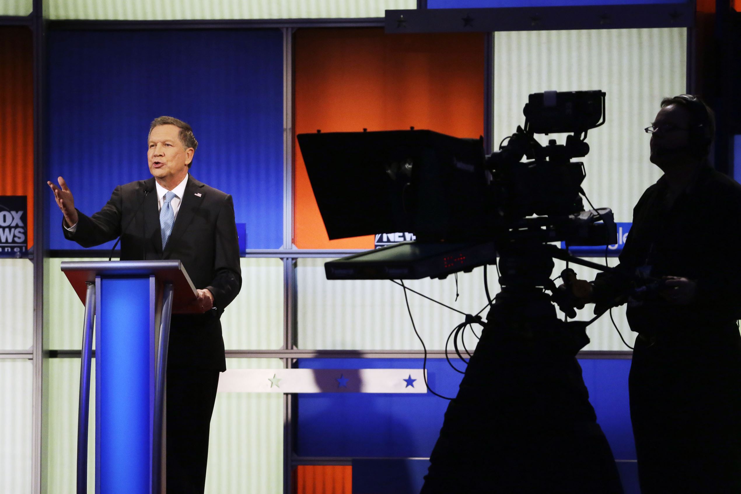 John Kasich argues a point during a Republican presidential primary debate, Jan. 28, in Des Moines, Iowa.
