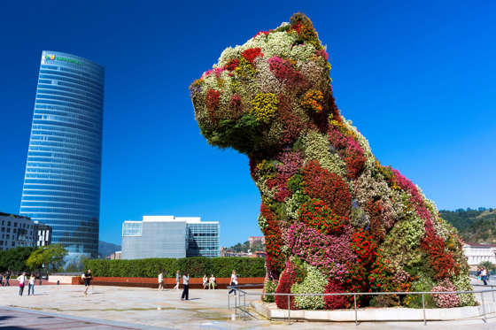 SPAIN - SEPTEMBER 15: Puppy flower feature floral art in dog form by Jeff Koons at Guggenheim Museum, Iberdrola Tower, Bilbao, Spain (Photo by Tim Graham/Getty Images)