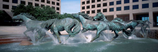 Original caption: This memorial to the heritage of Texas is believed to be the largest equestrian sculpture in the world.