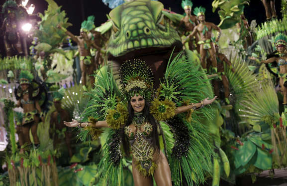A reveller from the Rocinha samba school dances as she takes part in the Group A category of the annual Carnival parade in Rio de Janeiro's Sambadrome, Brazil, February 5, 2016.
