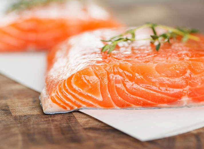 <p>Fatty fish like wild <a href="http://www.eatthis.com/shocking-facts-about-farmed-salmon">salmon</a> contain omega-3 fatty acids that help reduce inflammation, slow the plaque buildup inside blood vessels and increase the ratio of good to bad cholesterol levels, explains Koszyk. “They’ve also been shown to lower blood pressure, ddiecreasing the odds of stroke and heart failure.” Wondering how much to eat? An analysis of 20 studies published in the journal JAMA indicates that eating one to two 3-ounce servings of fatty fish a week reduces the risk of dying from heart disease by an impressive 36 percent! If you’re already suffering from heart disease Koszyk recommends upping your intake to three 4-ounce servings throughout the week. “In addition to the fish, taking three 1000 mg omega-3 vitamins containing EPA and DHA daily is recommended for those with heart disease. Don’t take them all at once, though. Take one in the morning, one at lunch, and one in the evening.” And be sure to bookmark, pin, print, and save our in-depth, exclusive report on <a href="http://www.eatthis.com/fish">40+ Popular Types of Fish—Ranked for Nutrition</a>.</p>