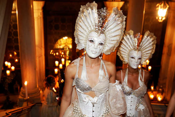 Masked performers wearing volto masks walk up the stairway at The Secret Garden of Dreams, a themed evening at the 23rd edition of Antonia Sautter's &quot;Il Ballo del Doge&quot; masked ball during the 2016 Carnevale di Venezia, in Venice, Italy, on Saturday, Feb. 6, 2016. The annual Venice Carnival runs for ten days, ending on the Christian celebration of Lent.