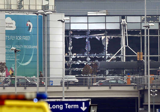 Broken windows seen at the scene of explosions at Zaventem airport.