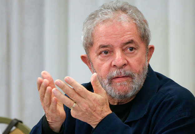 Brazil's former President Luiz Inacio Lula da Silva attends an extraordinary Worker's Party leaders meeting in Sao Paulo, Brazil, Monday, March 30, 2015. The meeting comes amid a new wave of protests, seen as a movement clearly channeled against current President Dilma Rousseff and her Workers' Party. (AP Photo/Andre Penner)