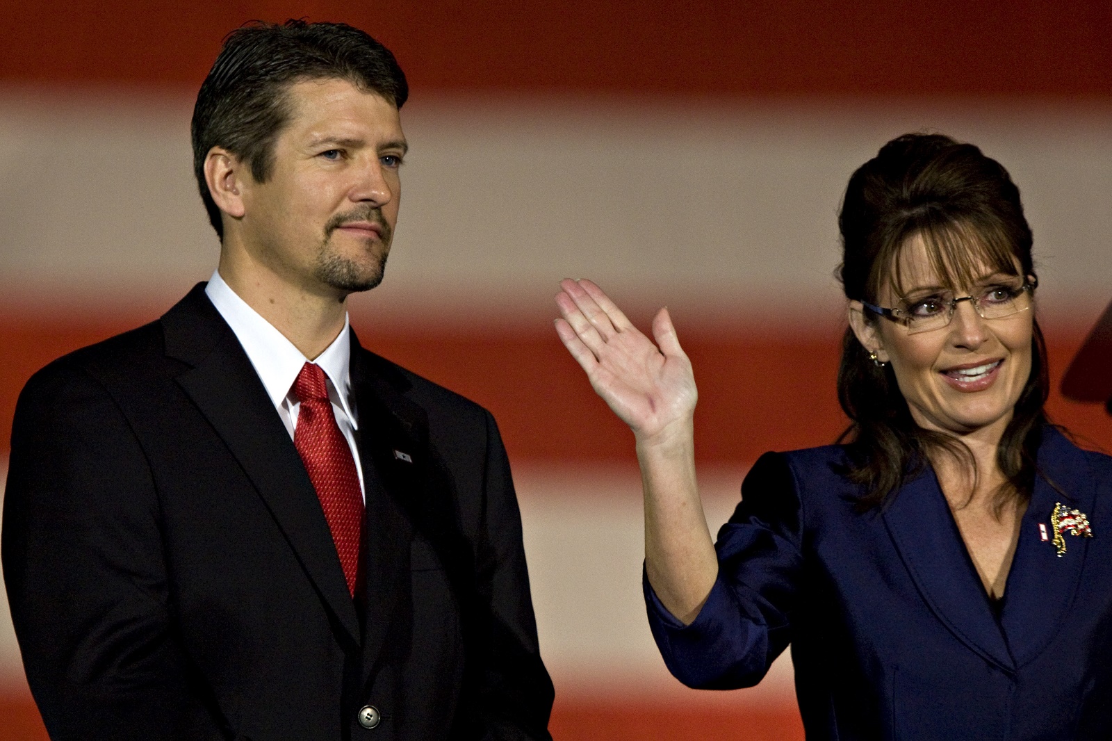 In this file photo, former Alaska Gov. Sarah Palin of Alaska, Republican vice presidential nominee, right, and her husband Todd, wave to supporters during a concession speech by Senator John McCain of Arizona, Republican presidential nominee, outside the Biltmore Hotel in Phoenix, Arizona, U.S., on Tuesday, Nov. 4, 2008.