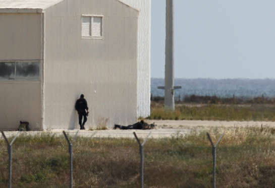 A police sniper keeps watch at Larnaca airport after an EgyptAir Airbus A-320 was hijacked and diverted to Cyprus on March 29, 2016. Everyone on board the hijacked EgyptAir flight diverted to Cyrus has been released except for four crew members and three passengers, Egypt's civil aviation minister said. / AFP / STR (Photo credit should read STR/AFP/Getty Images)