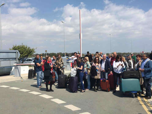 EgyptAir MS181 plane hijack, Larnaca International Airport, Cyprus - 29 Mar 2016 Passengers wait for a bus to Paphos at the Larnaca airport in Larnaca, Cyprus