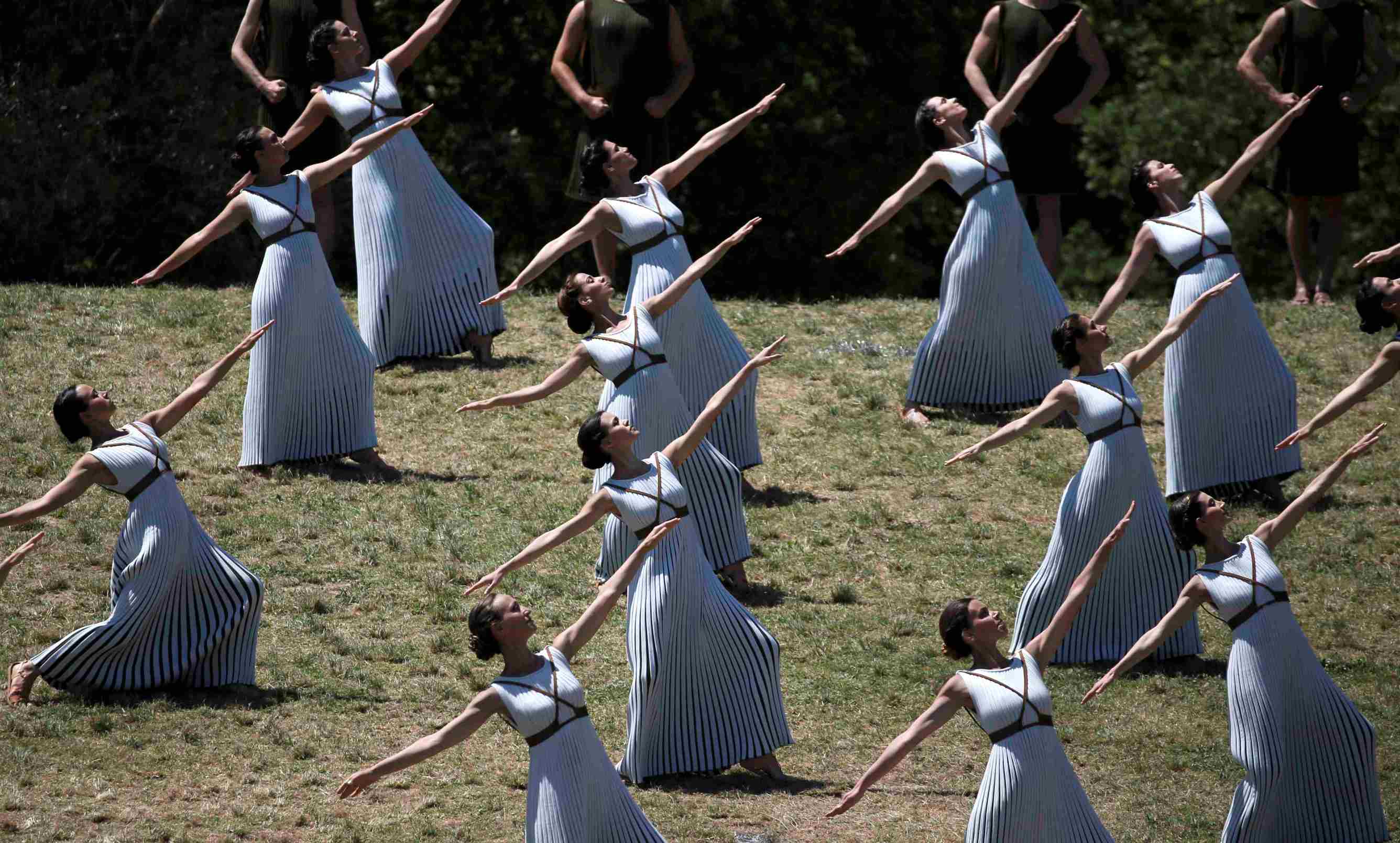 Priestesses and dancers perform during the ceremony.