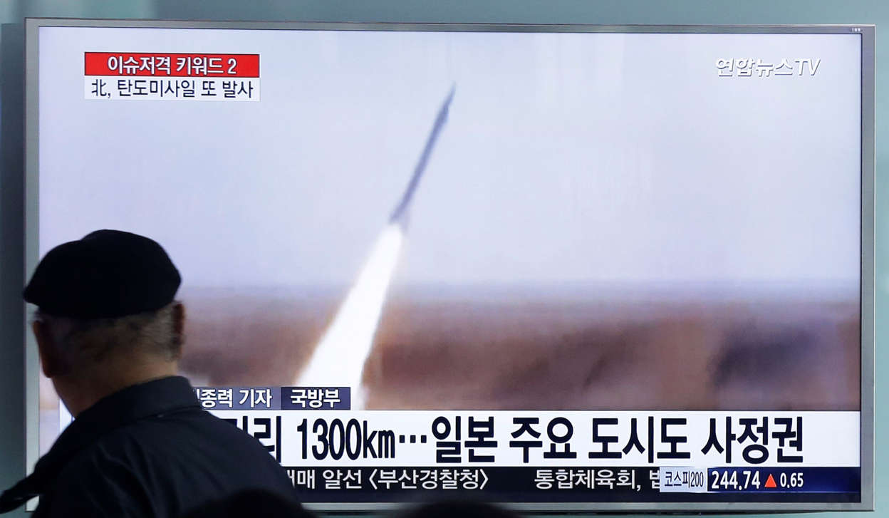 A man watches a TV screen showing a file footage of the missile launch conducted by North Korea, at Seoul Railway Station in Seoul, South Korea, Friday, March 18, 2016.