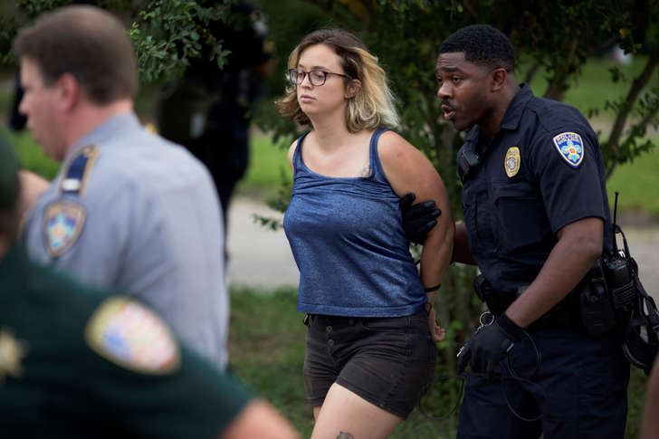 Police arrest protesters after dispersing crowds in a residential neighborhood in Baton Rouge, La. on Sunday, July 10, 2016.