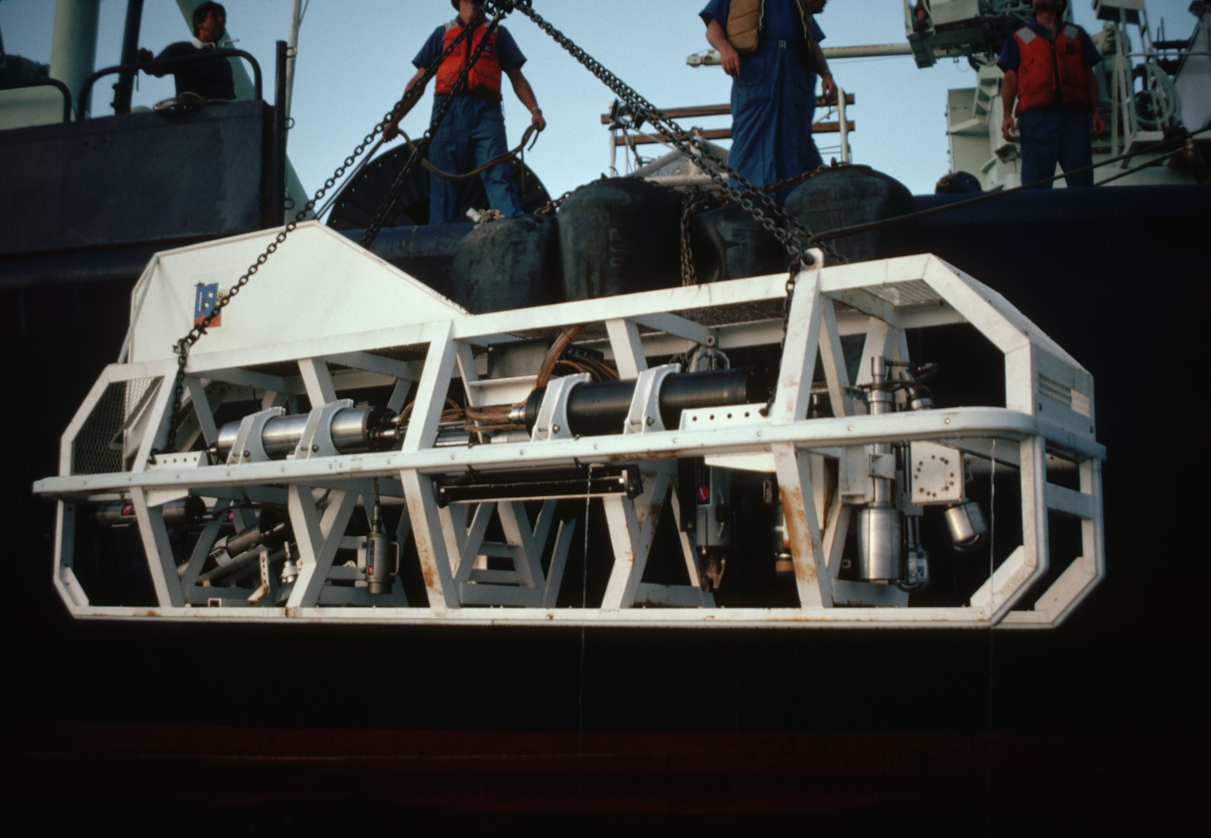 The crew of the Knorr prepare to launch the deep-sea camera sled ARGO on the search for the Titanic's wreck. The ARGO, a remote submersible, was the first vessel of any kind to detect the wreck.