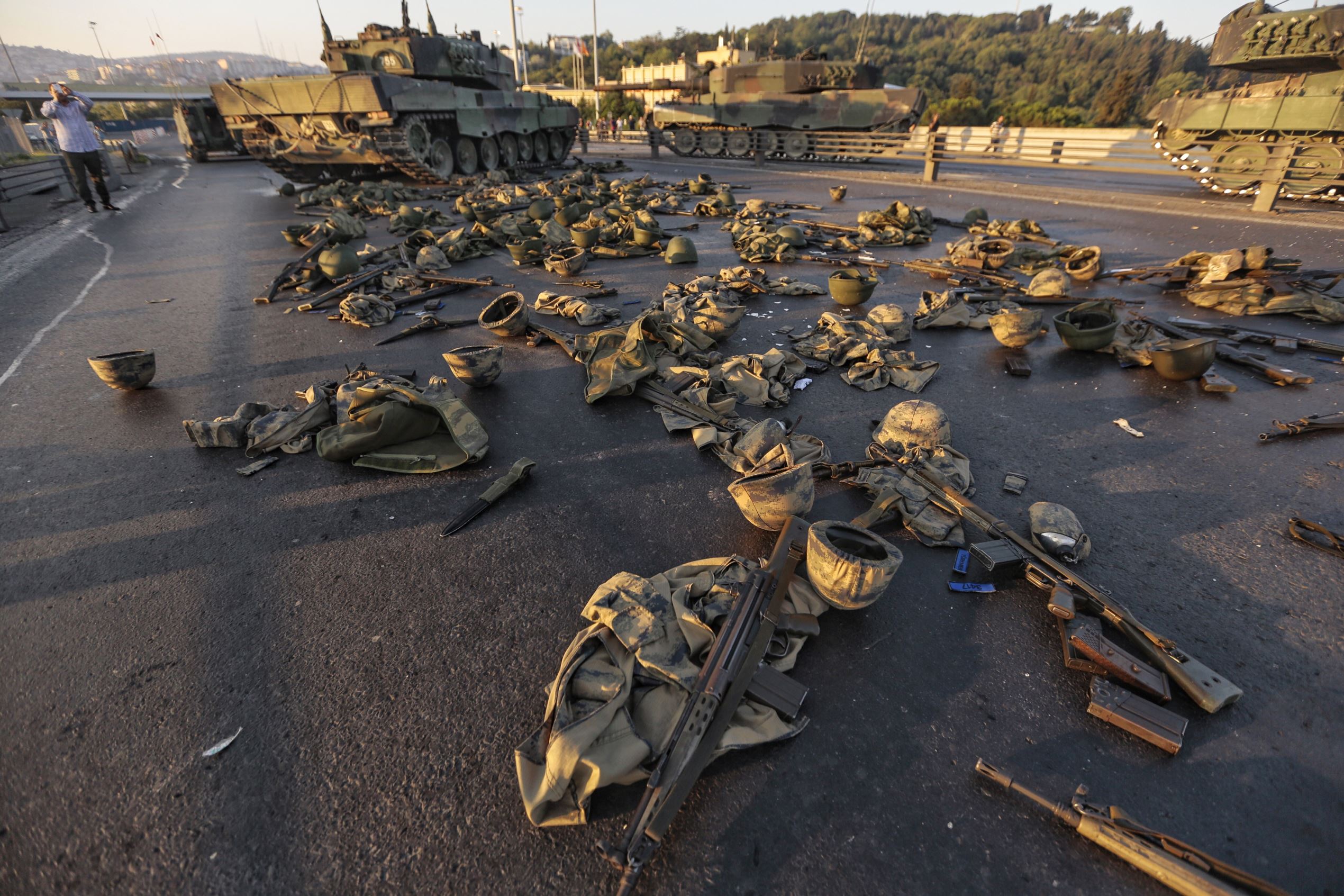 ISTANBUL, TURKEY - JULY 16: Clothes and weapons beloging to soldiers involved in the coup attempt that have now surrendered lie on the ground abandoned onBosphorus bridge on July 16, 2016, Istanbul,Turkey. Istanbul's bridges across the Bosphorus, the str