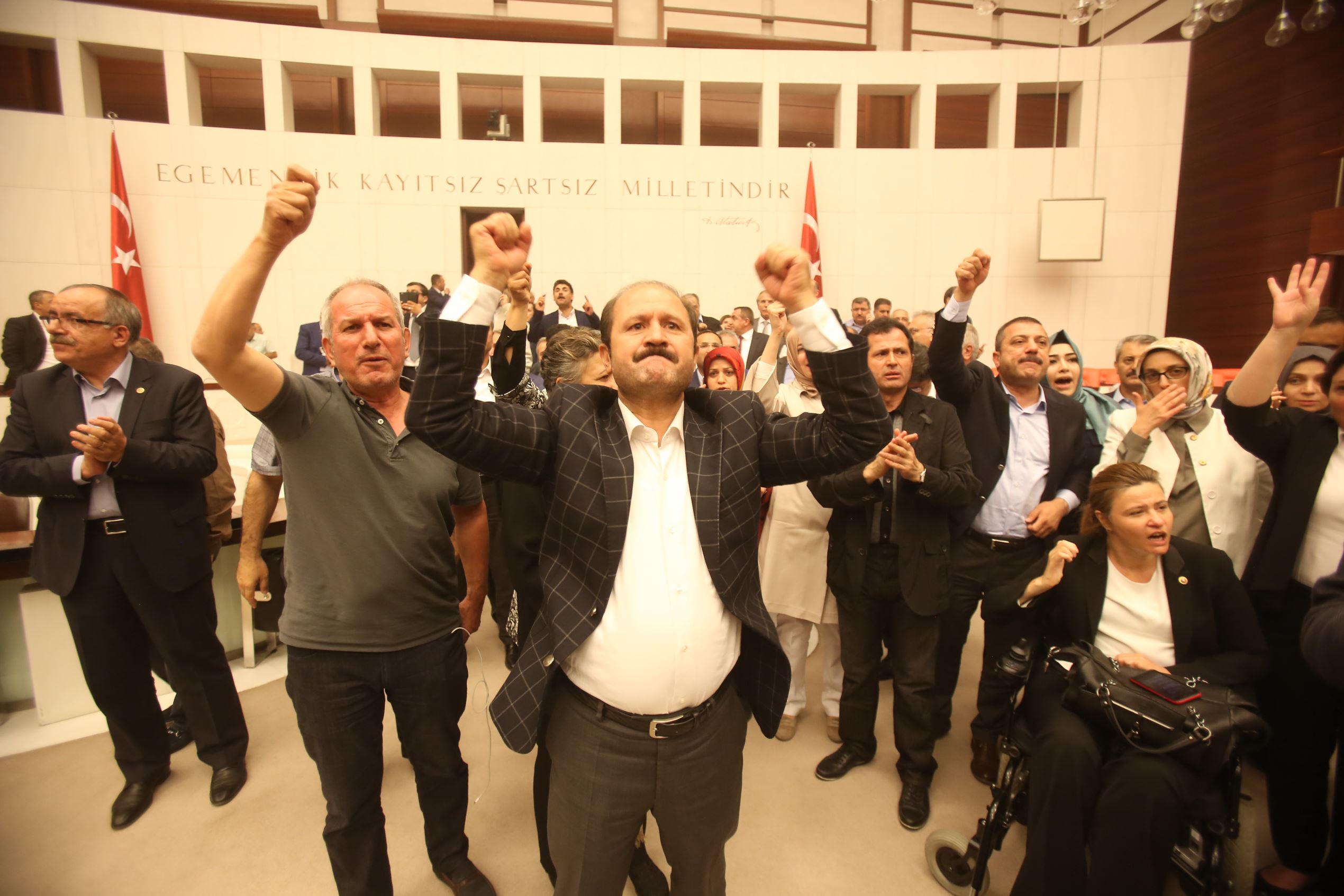 ANKARA, TURKEY - JULY 16: Turkey's MP's react to the attacks through the night at the Turkish parliament July 16, 2016 in Ankara, Turkey.  Istanbul's bridges across the Bosphorus, the strait separating the European and Asian sides of the city, had been c