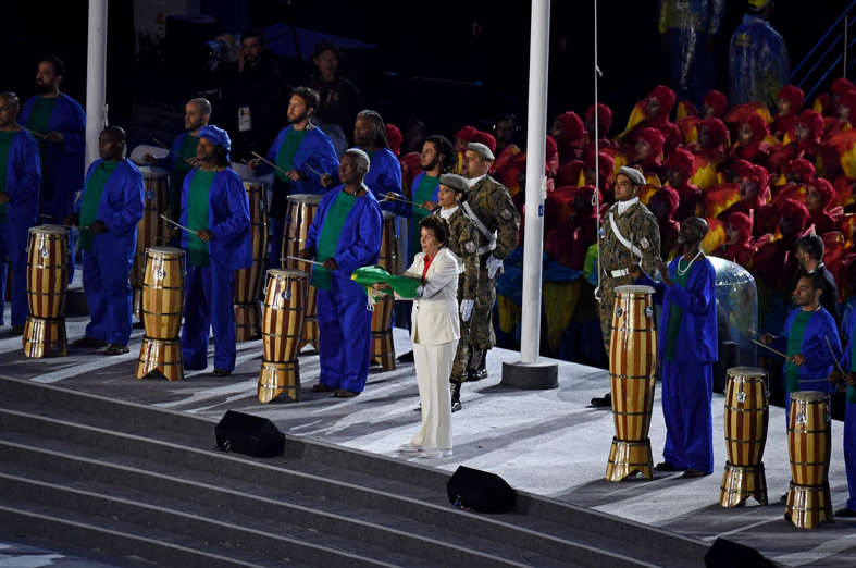 The Brazil flag is presented during the closing ceremonies for the Rio 2016 Summer Olympic Games at Maracana