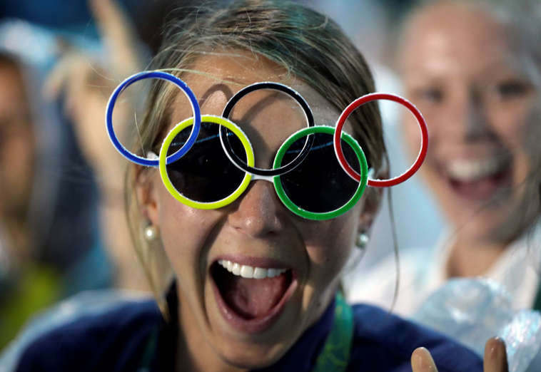 Jackie Briggs from the United States wears the Olympic ring sunglasses.