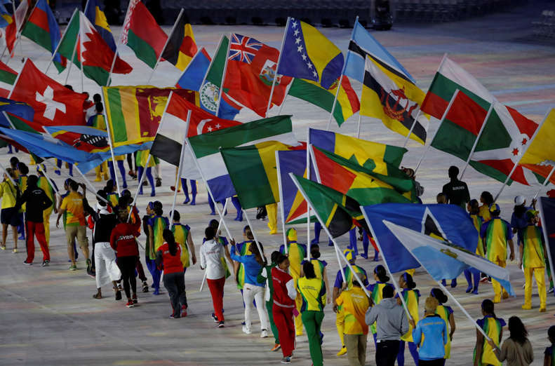 Flag bearers walk into the stadium during the closing ceremony for the Summer Olympics in Rio de Janeiro, Brazil, Sunday, Aug. 21, 2016. (AP Photo/Vincent Thian)