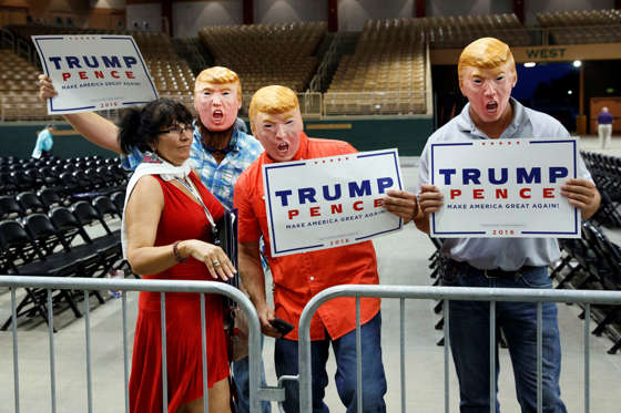 Supporters of Republican presidential candidate Donald Trump pose for a photograph after a campaign rally, Thursday, Aug. 11, 2016, in Kissimmee, Fla.