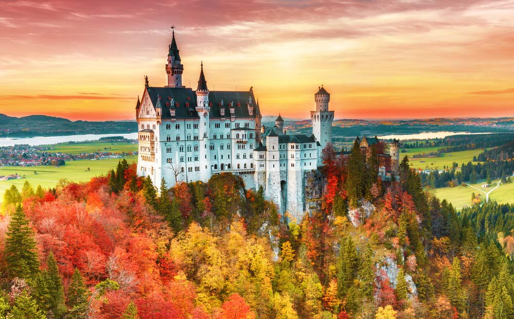 Slide 1 of 34: Beautiful aurumn view of Neuschwanstein castle in autumn season. Palace situated in Bavaria, Germany. Neuschwanstein castle one of the most popular palace and travel destination in Europe and world.