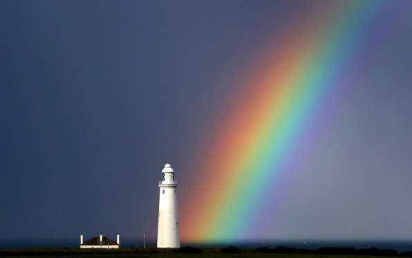 A rainbow at St Mary's lighthouse at Whitley Bay, in Tyne and Wear, on the north east coast of England.