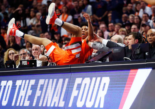 Slide 22 of 34: CHICAGO, IL - MARCH 27:  Malachi Richardson #23 of the Syracuse Orange falls off of the court in the second half against the Virginia Cavaliers during the 2016 NCAA Men's Basketball Tournament Midwest Regional Final at United Center on March 27, 2016 in 