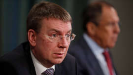 Latvian counterpart Edgars Rinkevics, left, says Canada and Latvia need to be prepared to counter Russian-backed cyber attacks as a part of Canada's NATO mission to deter Russian aggression in the country.