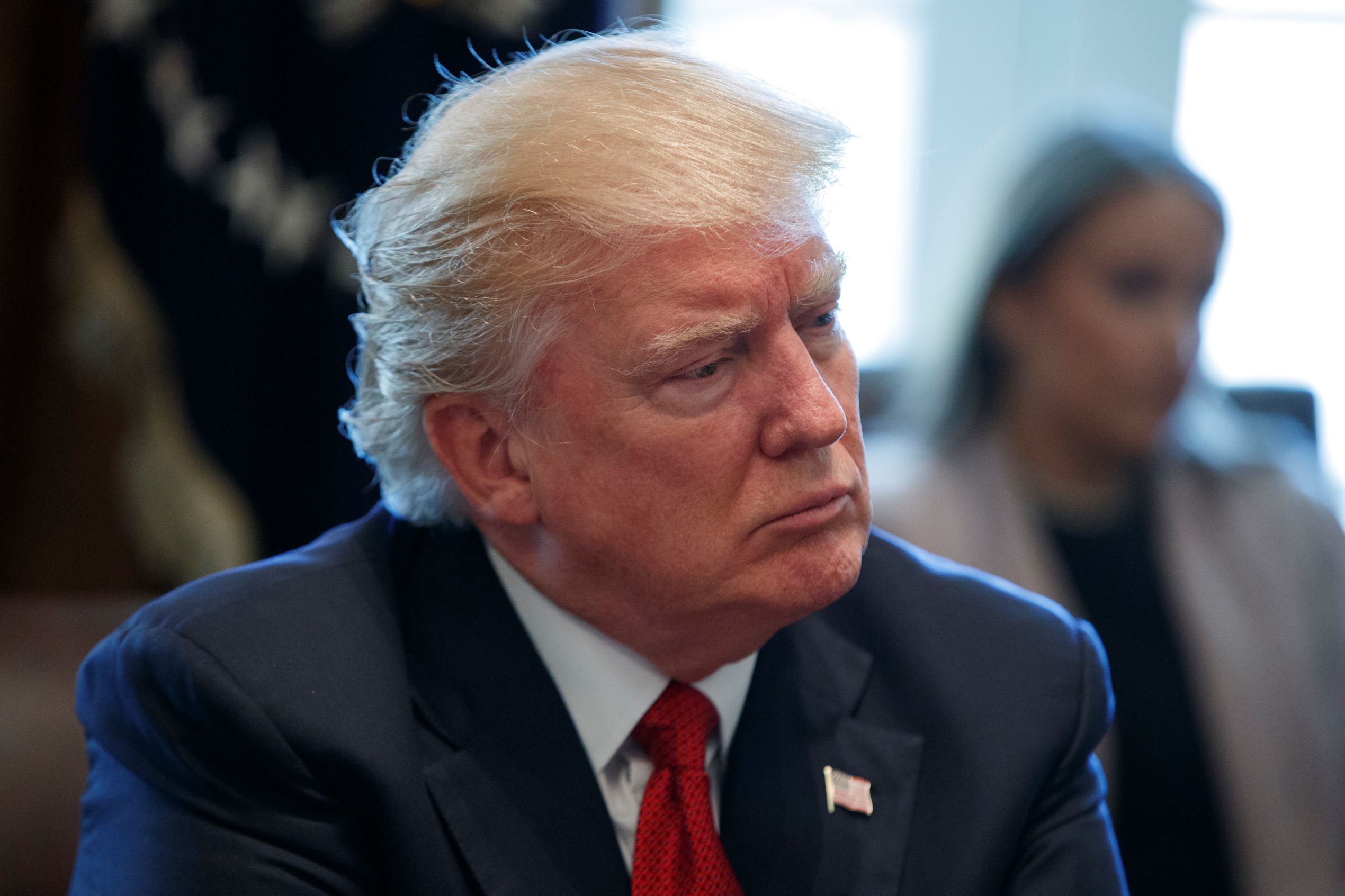 President Donald Trump listens in the Cabinet Room of the White House in Washington, Wednesday, March 29, 2017.