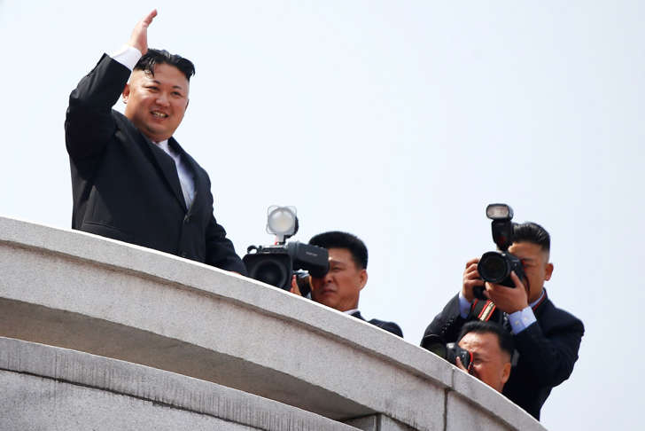 North Korean leader Kim Jong Un waves to people attending a military parade marking the 105th birth anniversary of country's founding father Kim Il Sung, in Pyongyang April 15, 2017.