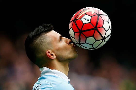 MANCHESTER, ENGLAND - OCTOBER 03: Sergio Aguero of Manchester City kisses the ball to celebrate a goal and his hat-trick during the Barclays Premier League match between Manchester City and Newcastle United at Etihad Stadium on October 3, 2015 in Manchester, United Kingdom. (Photo by Dean Mouhtaropoulos/Getty Images)