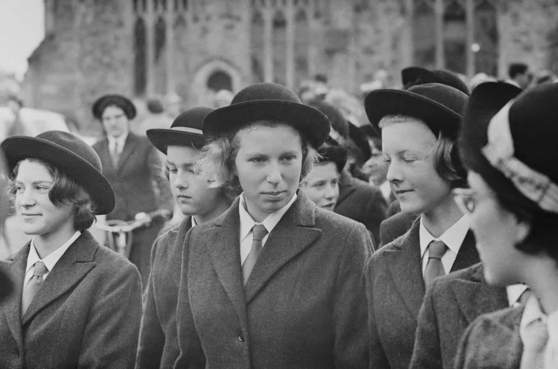 <p>Queen Elizabeth's daughter Princess Anne (pictured center)—later Anne, Princess Royal—with fellow pupils during her first term at Benenden School, an independent boarding school for girls in Kent, England, on September 23, 1963.</p>