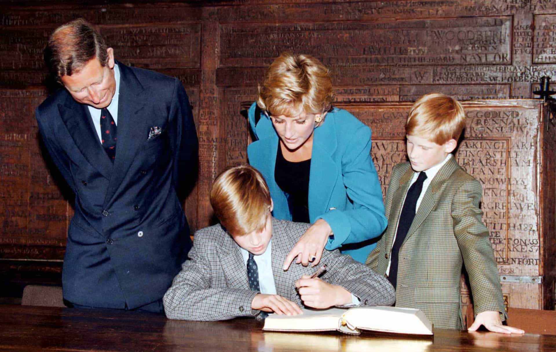 <p>Prince William signs in on his first day at Eton College watched by his parents, the Prince and Princess of Wales, and brother, Prince Harry, on September 6, 1995, in Windsor, England.</p>