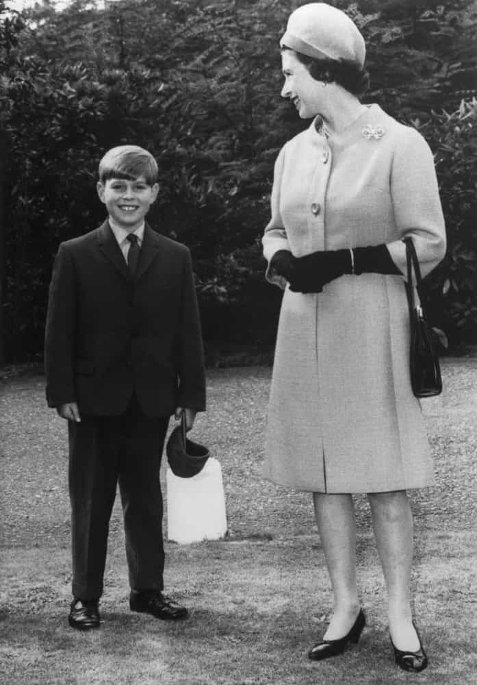 <p>Queen Elizabeth II accompanies her son, Prince Andrew, to Heatherdown Preparatory School at Ascot, England. It's 1968 and the prince is just eight years old.</p>