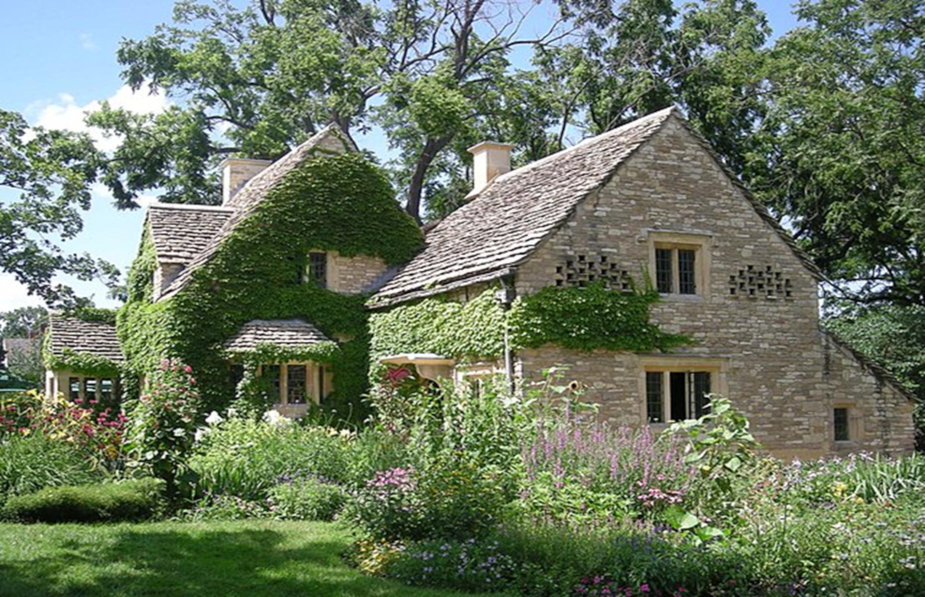 <p>An architectural highlight of the village, though it might seem slightly incongruous with its surroundings, is this 1619 Cotswold Cottage, imported from England. Over several visits to England in the 1920s, Henry Ford fell in love with the quaint and characteristic Cotswolds architecture. By 1929, so great was his love for these buildings that he decided to purchase, deconstruct, and move a Cotswolds cottage all the way to his home in Greenfield, Michigan, where it was reassembled and still stands to this day.</p>
