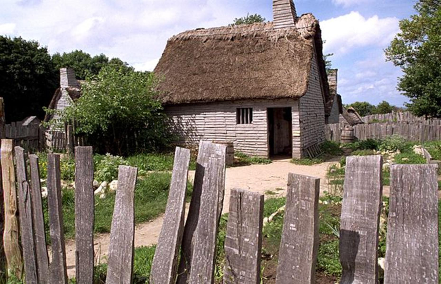 <p>The English village features a collection of reconstructed 17th-century timber-framed houses, each outfitted with reproduction furniture, household items, and articles of clothing. Most of these structures consist of only one room, and the barest of essentials. The village is set in the year 1627, when the settlers were desperately fighting for survival in the harsh New England climate. In the surrounding gardens and fields, third-person costumed interpreters pound corn, pull weeds, or even engage in a ‘muster drill’ led by Captain Myles Standish, commander of the Plymouth Colony Militia.</p>