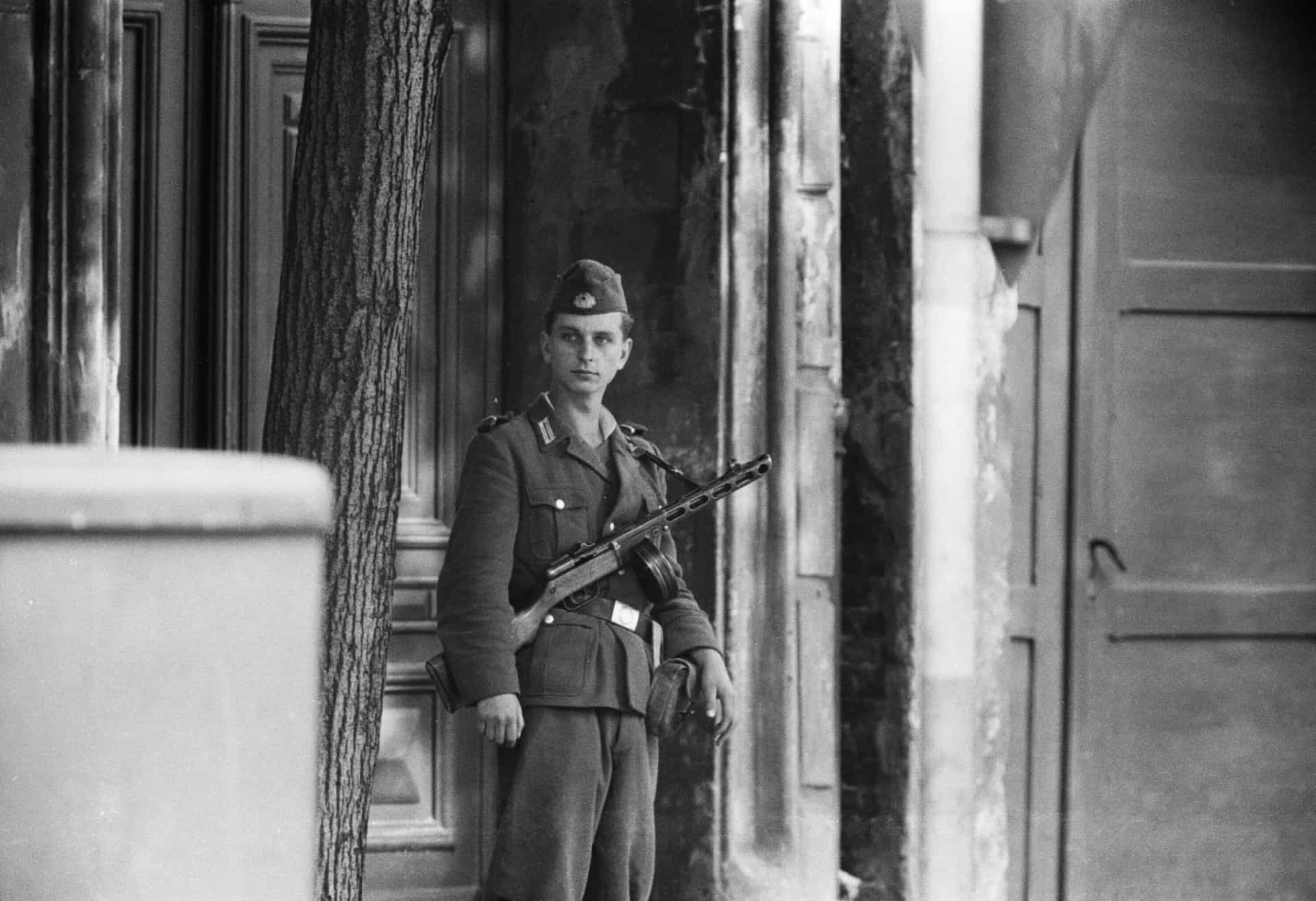 <p>Pictured: a young East German border guard keeps watch on the streets of Berlin after all East-West border points were closed.</p><p>You may also like: <a href="https://www.starsinsider.com/n/363610?utm_source=msn.com&utm_medium=display&utm_campaign=referral_description&utm_content=509600en-us">Creepy and fascinating ghost towns you can actually visit</a></p>