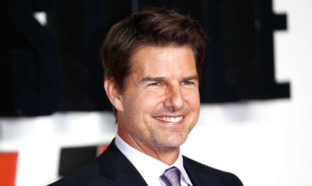 Slide 1 of 26: Tom Cruise is one of the few Hollywood stars who can fill a movie theater with just their presence. 'Top Gun: Maverick' and the 'Mission: Impossible' films are examples of that.