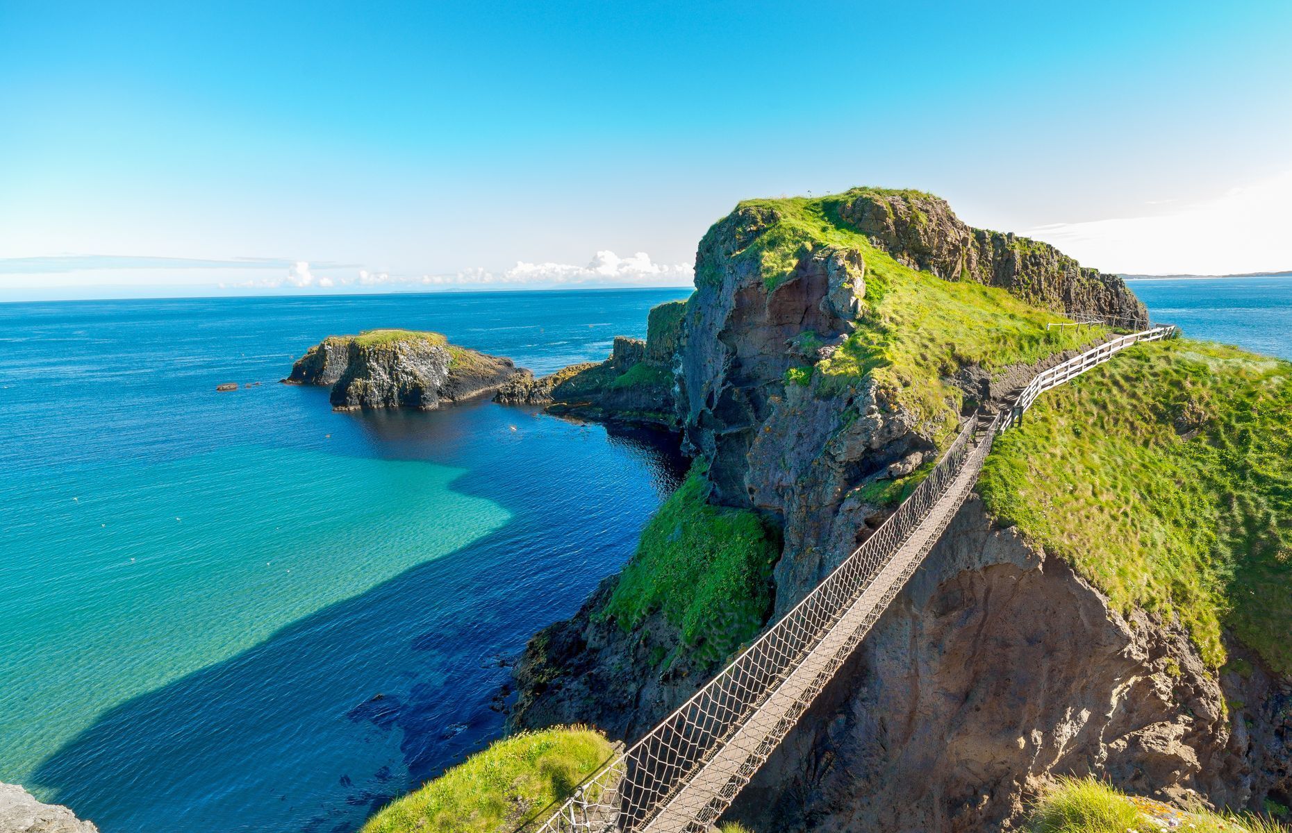 <p>Built in 1755 by salmon fishermen to access <a href="https://www.nationaltrust.org.uk/carrick-a-rede" rel="noreferrer noopener">Carrick-a-Rede Island</a><a href="https://www.nationaltrust.org.uk/carrick-a-rede" rel="noreferrer noopener">,</a> this suspension bridge helps visitors cross an imposing chasm that’s more than 30 metres deep. The unusual walkway also offers a breathtaking view of the sea and coastal road.</p>