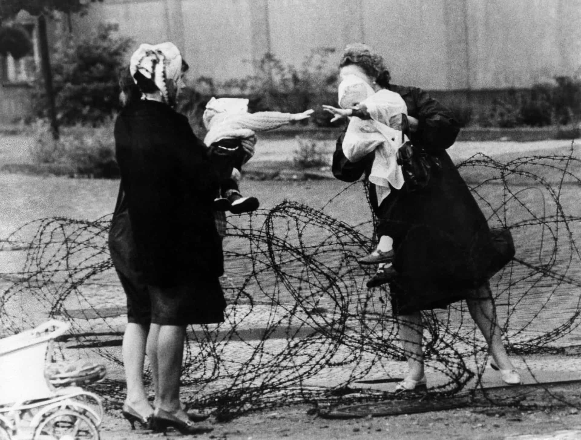 <p>This poignant image captures the heartache and bewilderment felt by many on both sides of the wall as they tried to communicate with family and friends during the early days of the divide, when the barricade was not much more than tangled barbed wire fence.</p><p>You may also like: <a href="https://www.starsinsider.com/n/280960?utm_source=msn.com&utm_medium=display&utm_campaign=referral_description&utm_content=509600en-us">Celebrities who were found dead in hotels</a></p>