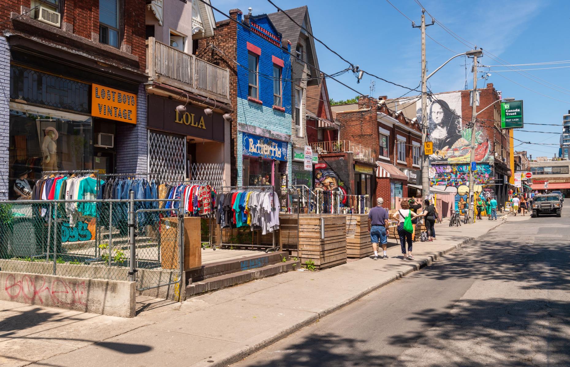 <p>A delightfully eclectic collection of shops, eateries and Victorian houses converted into apartments, <a href="http://www.kensington-market.ca">Kensington Market</a> is the heart of old-school bohemian <a href="https://www.loveexploring.com/guides/75296/explore-toronto-the-top-things-to-do-where-to-stay-what-to-eat">Toronto</a>. Locals and tourists alike flock to its open air stalls for groceries and vintage clothes, or for world-class people watching over a coffee and casual bite to eat. The area has an artsy, hippie vibe and is packed with treasures to uncover and unique characters to meet.</p>